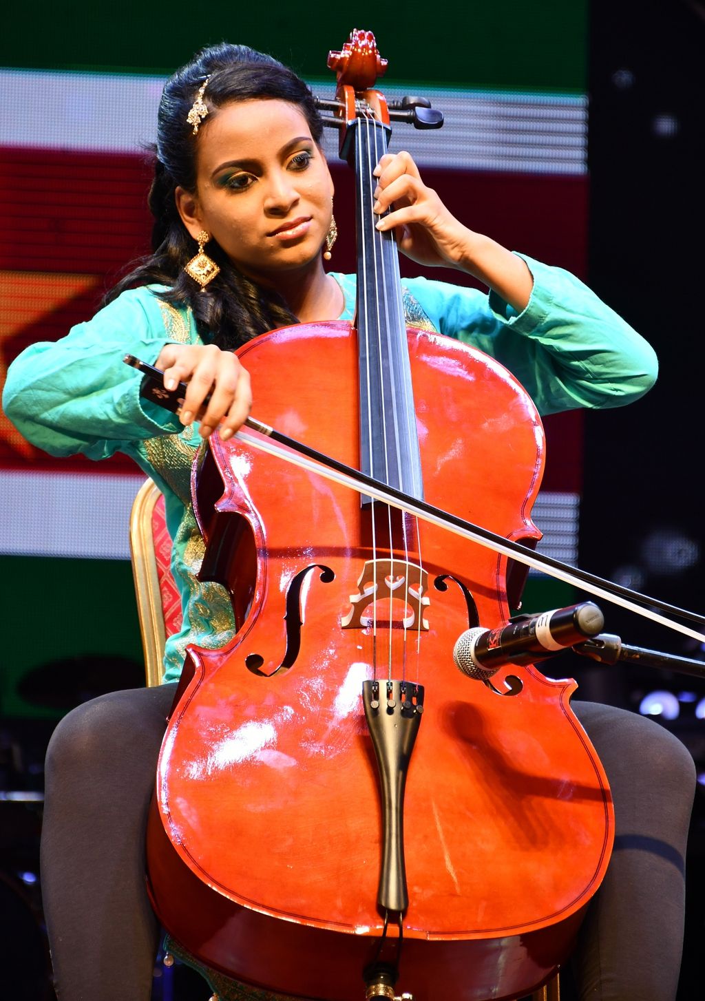 Robin Nandlal of Suriname plays the cello during the talent section of the pageant.