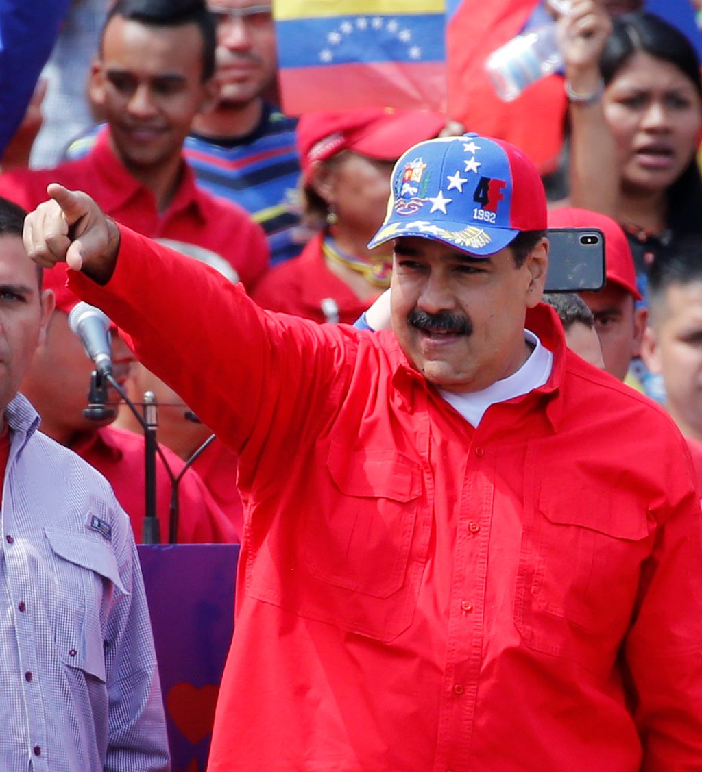 President Nicolas Maduro greet supporters as they arrive at a rally in Caracas, Venezuela, Saturday, Feb. 2, 2019. Maduro called the rally to celebrate the 20th anniversary of the late President Hugo Chavez's rise to power. (AP Photo/Ariana Cubillos)