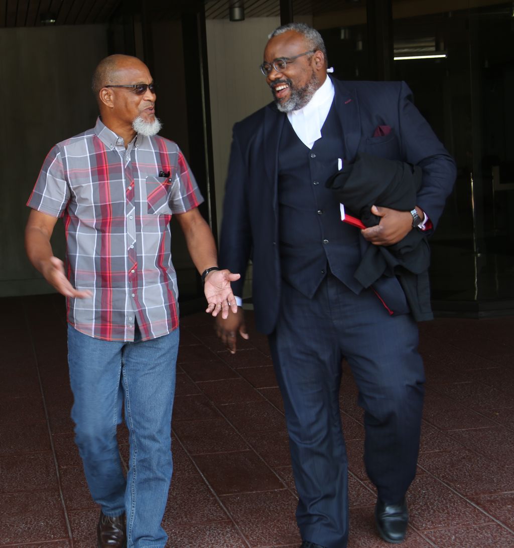 T&T Super League President, Keith Look Loy, left, with his attorney Matthew Gayle leaves Hall of Justice after winning his care against the TTFA back in March.