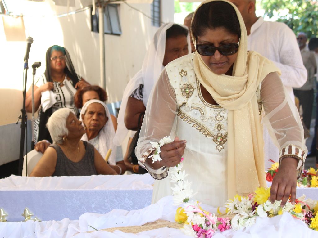 Pundit at funeral of father, daughter Trinidad Guardian