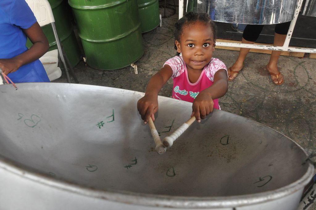  Four year old Ascala Daniels plays a the tenor pan at the Steel Foundation’s eight annual Summer Pan Camp at the Pan Palais along the Southern Main Road, Marabella yesterday. 