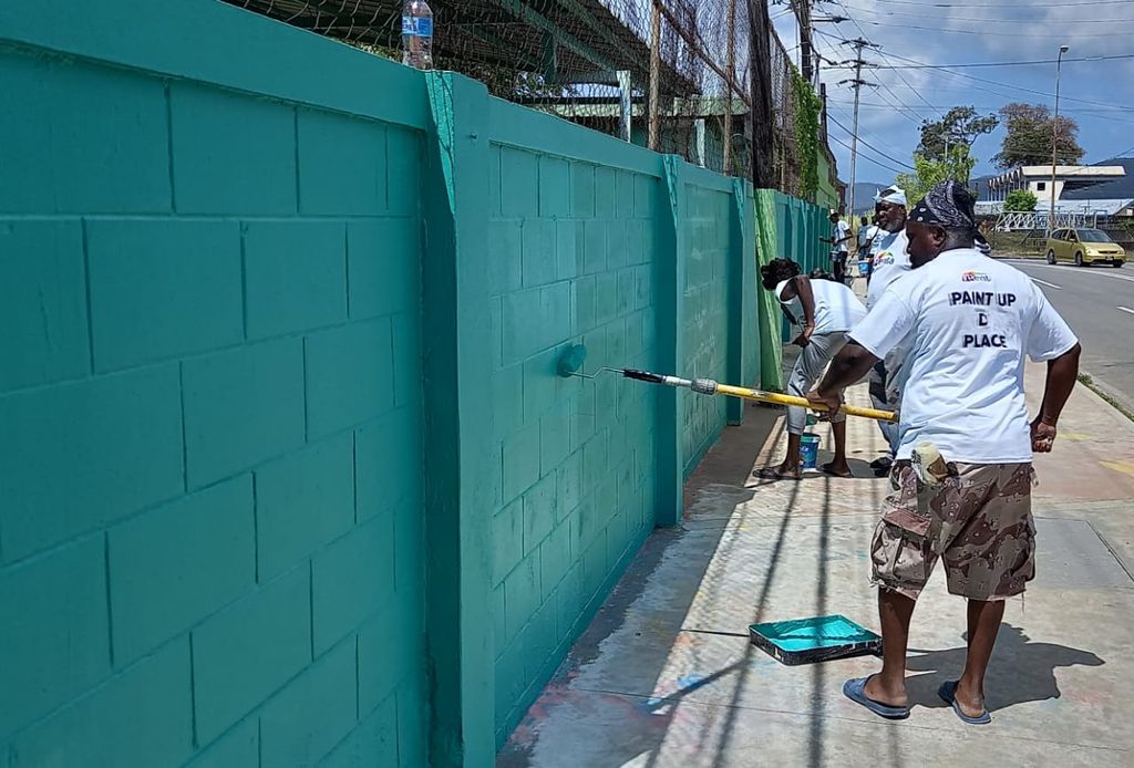 Penta helps clean up stained walls after J’Ouvert Trinidad Guardian