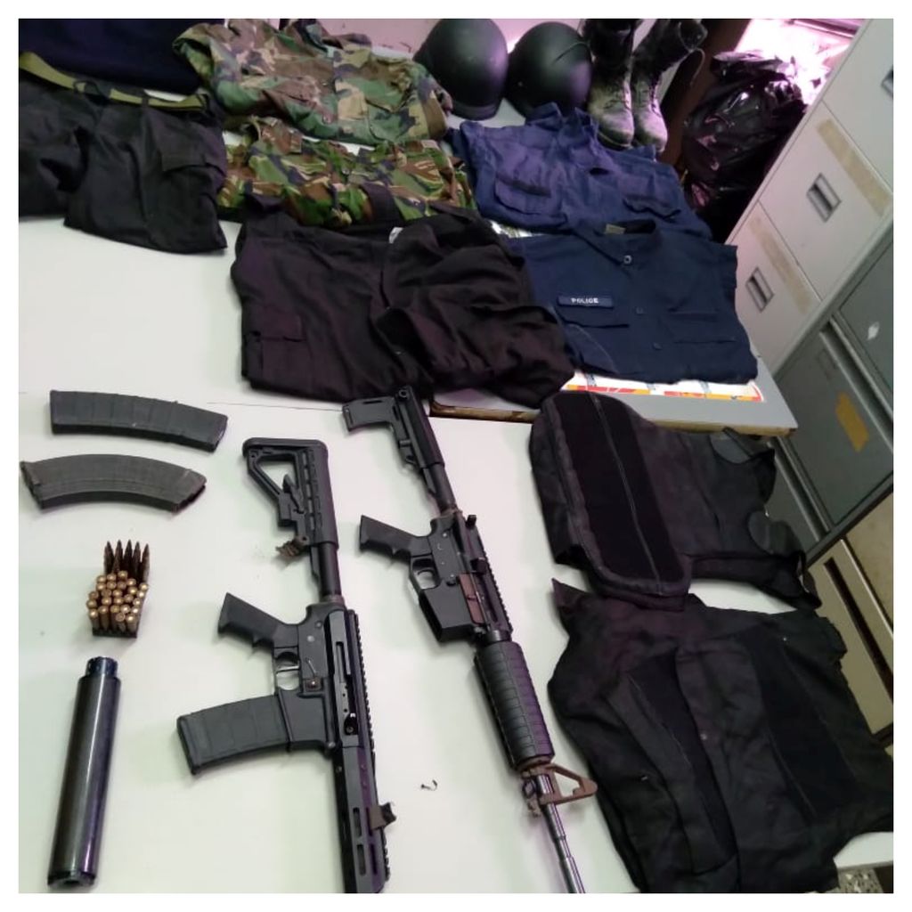 Cops seize assault rifles, camouflage, bulletproof vests helmets in