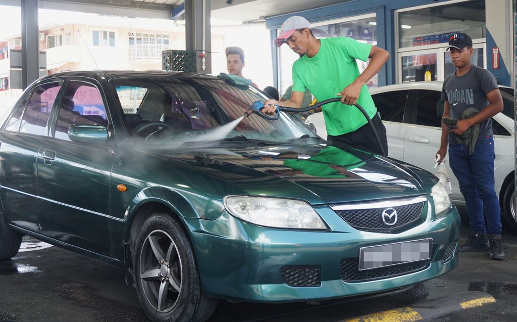 Hosepipe ban keeps car wash owners under pressure Trinidad Guardian