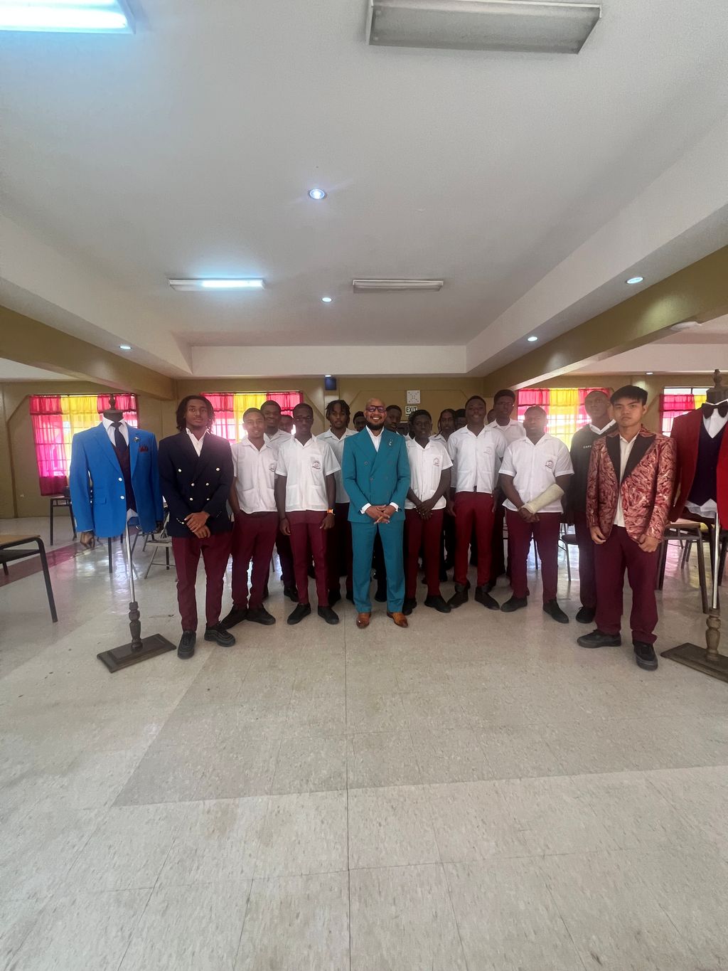 Ecliff Elie suits up Tobago student for milestone graduation