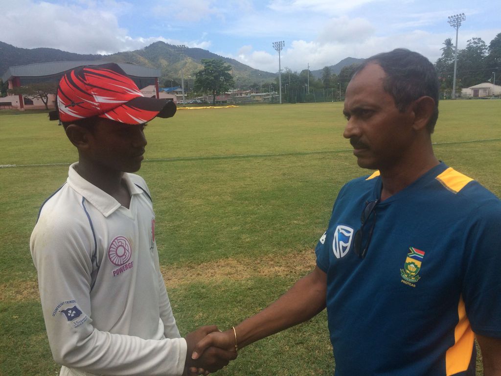Captain of the T&T U-15 team Rajeev Ramnath with manager of the team Narine Bideshi at UWI Spec yesterday.