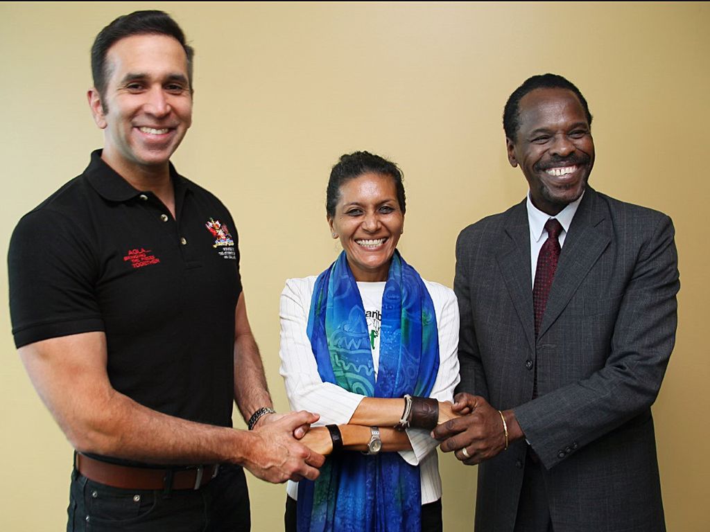   Caribbean Collective for Justice (CCJ) head, Nazma Muller, centre, with Attorney General Faris Al Rawi, left, and Minister in the Ministry of the Attorney General  Fitzgerald Hinds following a meeting at AGLA tower at Government Campus Plaza on Richmond Street, Port-of-Spain, yesterday.