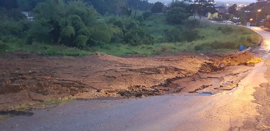 Residents do own repairs after road caves in - Trinidad Guardian