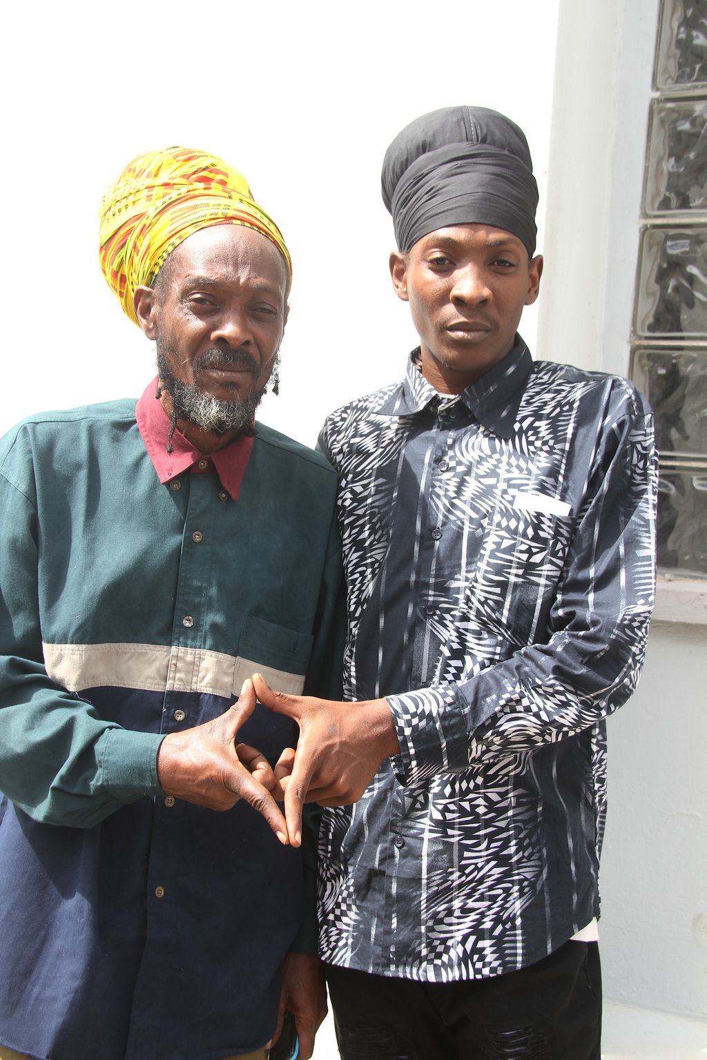 Makaan Grant, right with his father Eric Grant outside the San Fernando Magistrates’ Court yesterday.