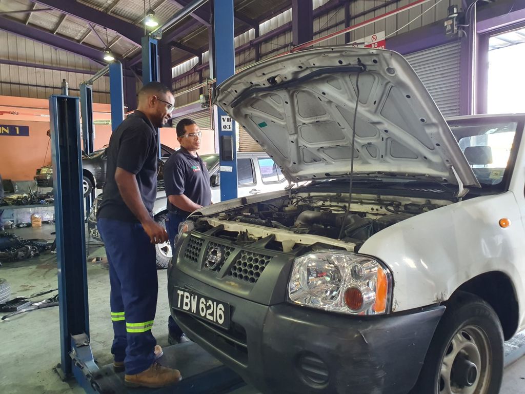 VMCOTT workers carry out an inspection of a vehicle in August 2019.