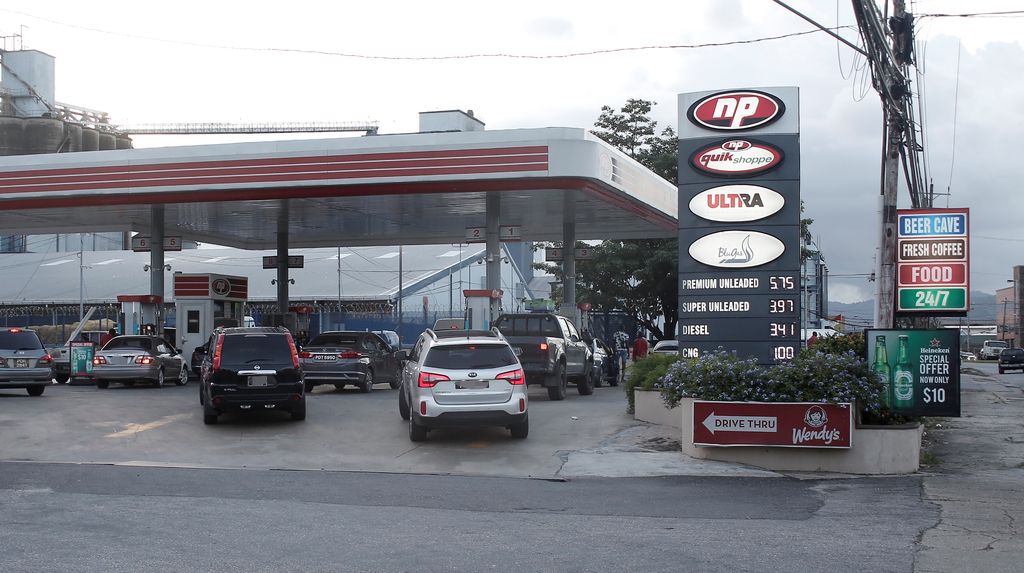 Customers at St Christopher’s Service Station on Wrightson Road.