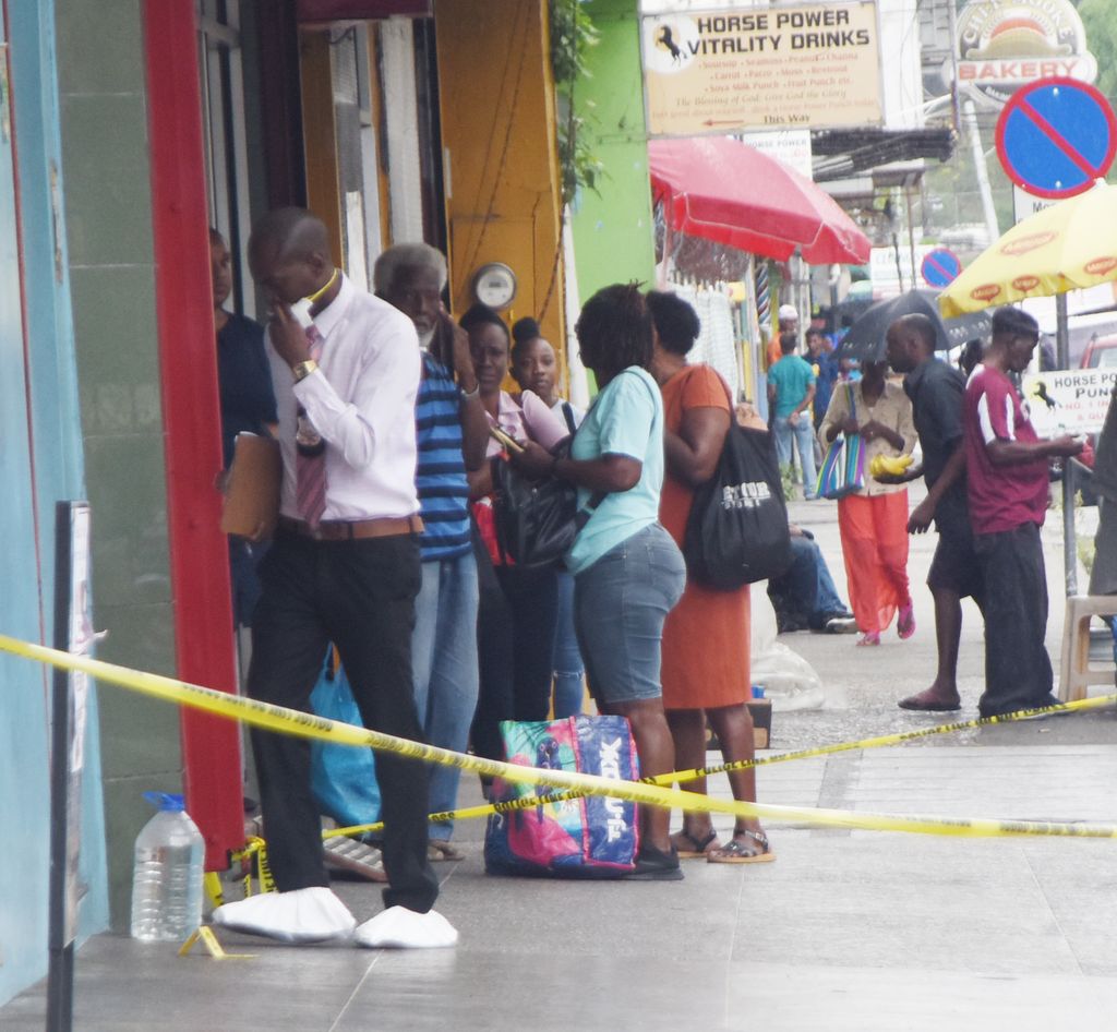A police investigator enters the the building the Baby’s Pre-School on Independence Square where Jezelle Philip was murdered on January 6.