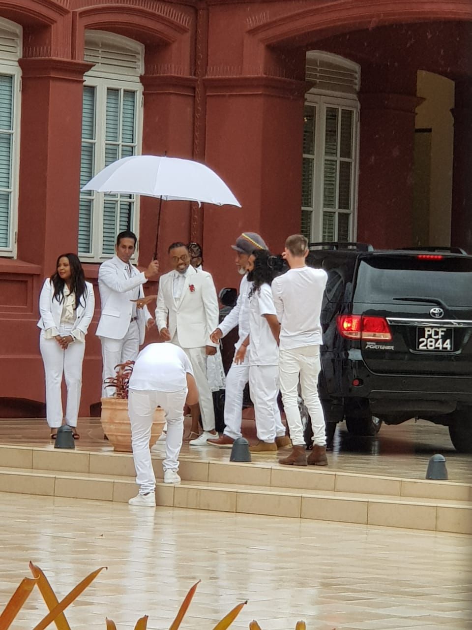 Machel Montano and his wedding party at the Red House for his wedding to Renee Butcher today.
