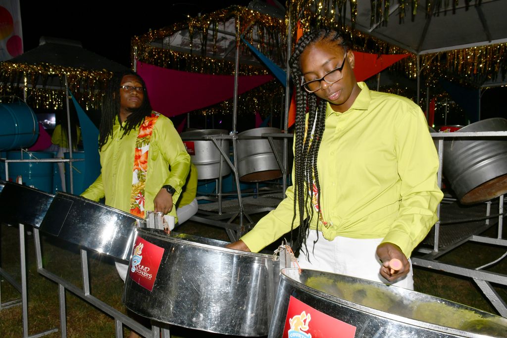 Members of Courts Sound Specialists of Laventille Steel Orchestra go through their rendition before going on stage during the National Panorama Medium band finals in Tobago last night.