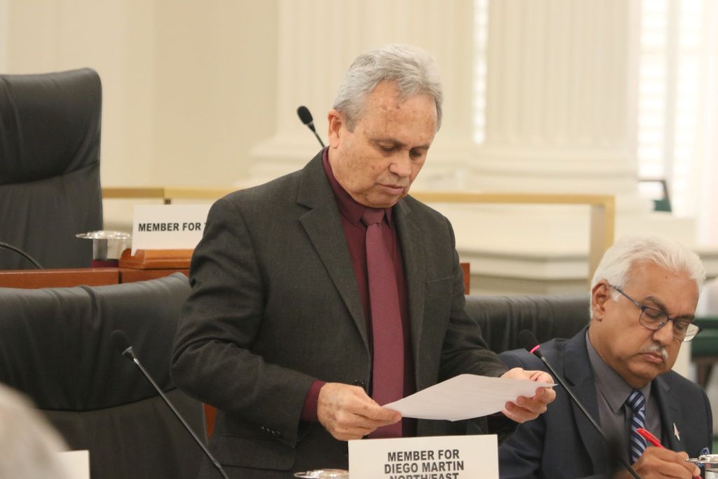 Ag Prime Minister and the Minister of Finance Colm Imbert lays some papers before the House during yesterday’s sitting of Parliament. Imbert also said he did not give any instructions to the Customs and Excise Division related to a recent decision to change the bond payment policy the Piarco International Airport. 