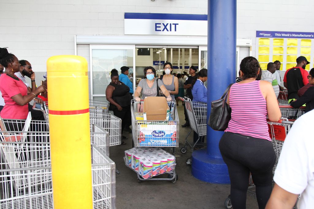 Shoppers leave PriceSmart’s MovieTowne branch on Thursday, hours after Prime Minister Dr Keith Rowley announced stricter COVID-19 measures to kick in tomorrow.