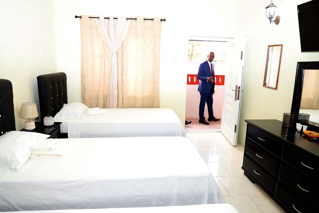  File picture November 2019, Prime Minister Dr Keith Rowley looks into one of the rooms at the Home of Football in Couva after the opening ceremony.