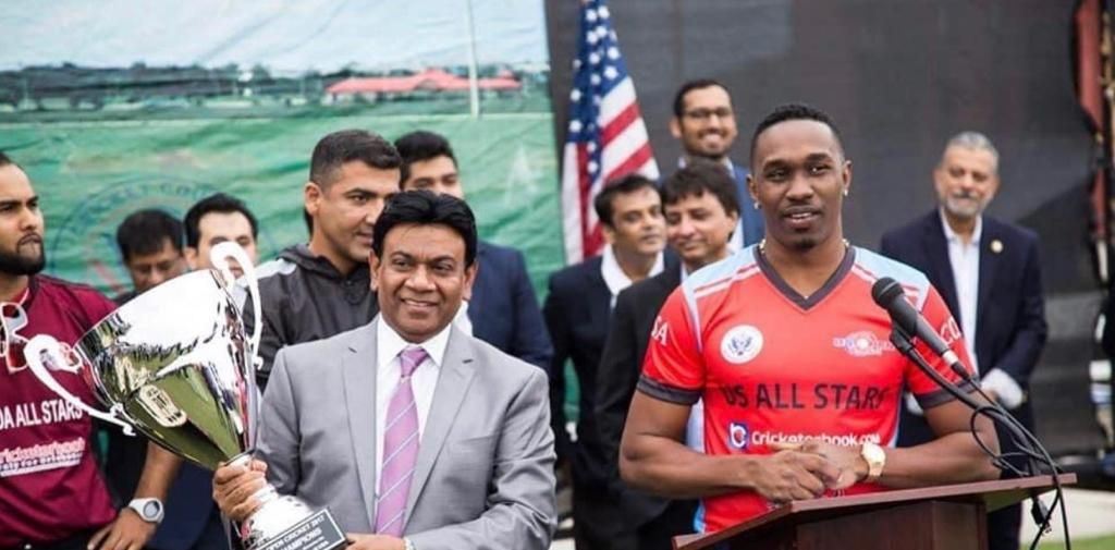 Chairman of CCUSA Mahammad Qureshi, left, and Dwayne Bravo at the US Open. 