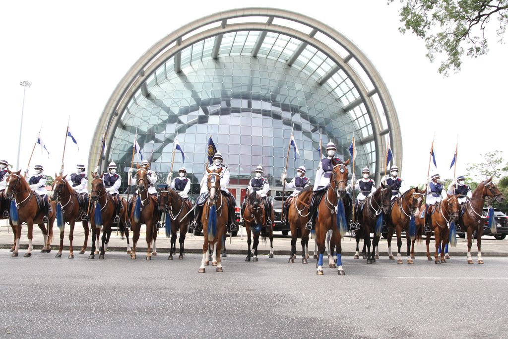President Paula-Mae Weekes’ Mounted Branch escort line up outside NAPA.