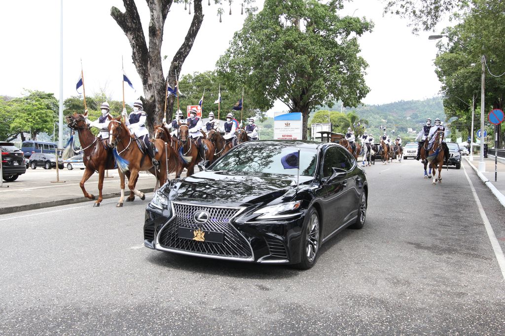 President Paula-Mae Weekes arrives with a Mounted Branch escort.