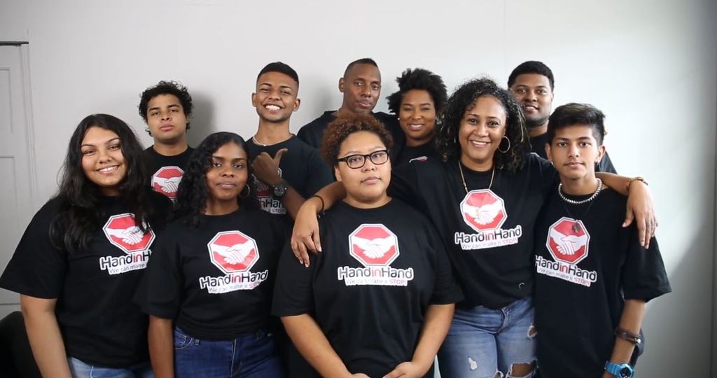  Local Tiktokkers in their hand- in- hand initiative t-shirts 