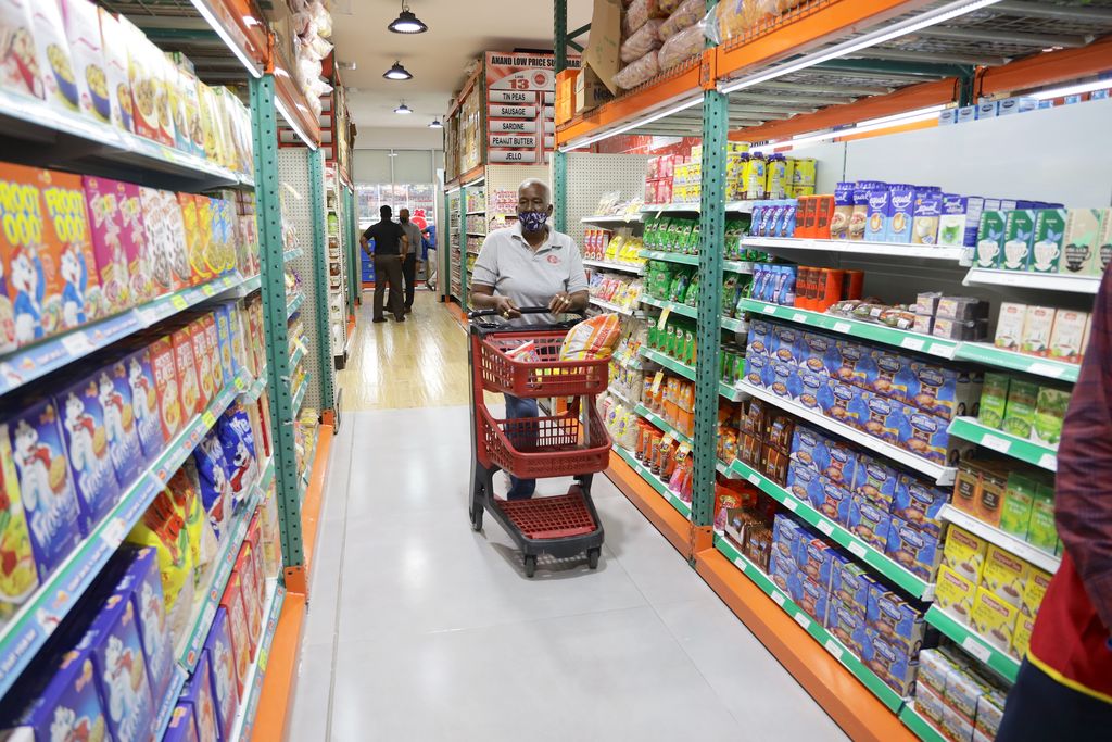 FILE: A customer shops at the Anand Low Price Supermarket in South Park Plaza, San Fernando in March.