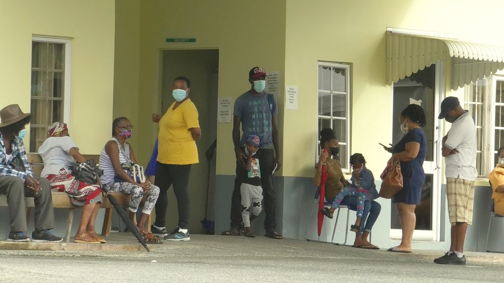 Members of the public wait outside the Scarborough Health Centre for the COVID-19 vaccine yesterday, 