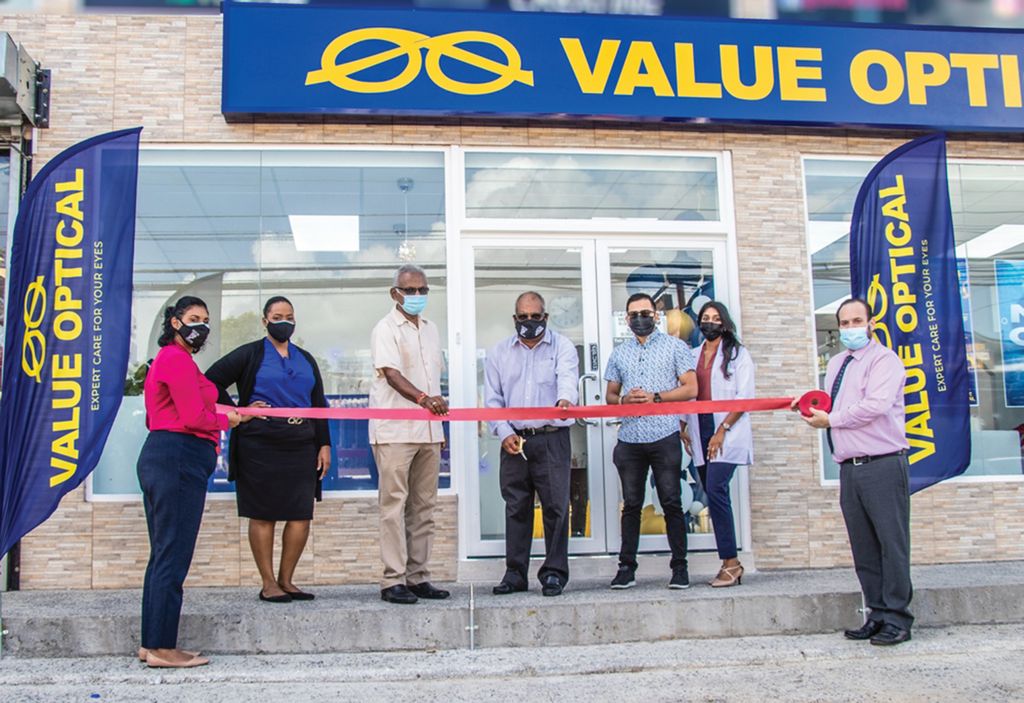 From left, Shelly-Ann Seecharan-Rogers (optician),  Margarete Harvey (branch manager),  Couva South MP Rudranath Indarsingh,  Value Optical director Kelly Bainey, radio personality Veekash Sahadeo, Sangita Maharaj (optometrist) and Danny Jones (brand development manager) at the official opening of Value Optical’s 14th store in Couva recently.  