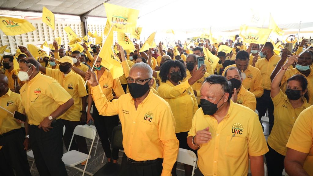 UNC MPs Rudy Indarsingh and David Lee among supporters during the party’s Joint Parliamentary Arm and National Congress at the Couva South Multipurpose Hall on Saturday. 