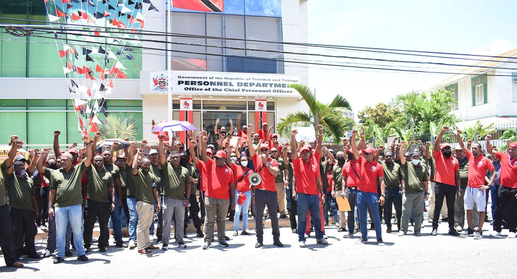 Prison and Fire Services union members protest outside the CPO's Office on Alexandra Street, Port-of-Spain, Friday.