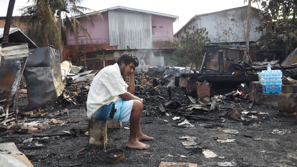 Daryal Biptah sits in shock after a fire destroyed his home on John Street, Marabella, earlier this month.