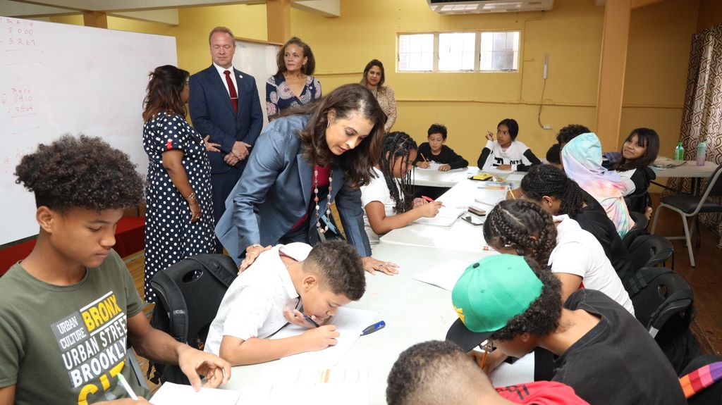 US Ambassador Candace Bond interacts with pupils of the La Romain Migrant Support at St Benedict’s Church in La Romain during her visit recently.