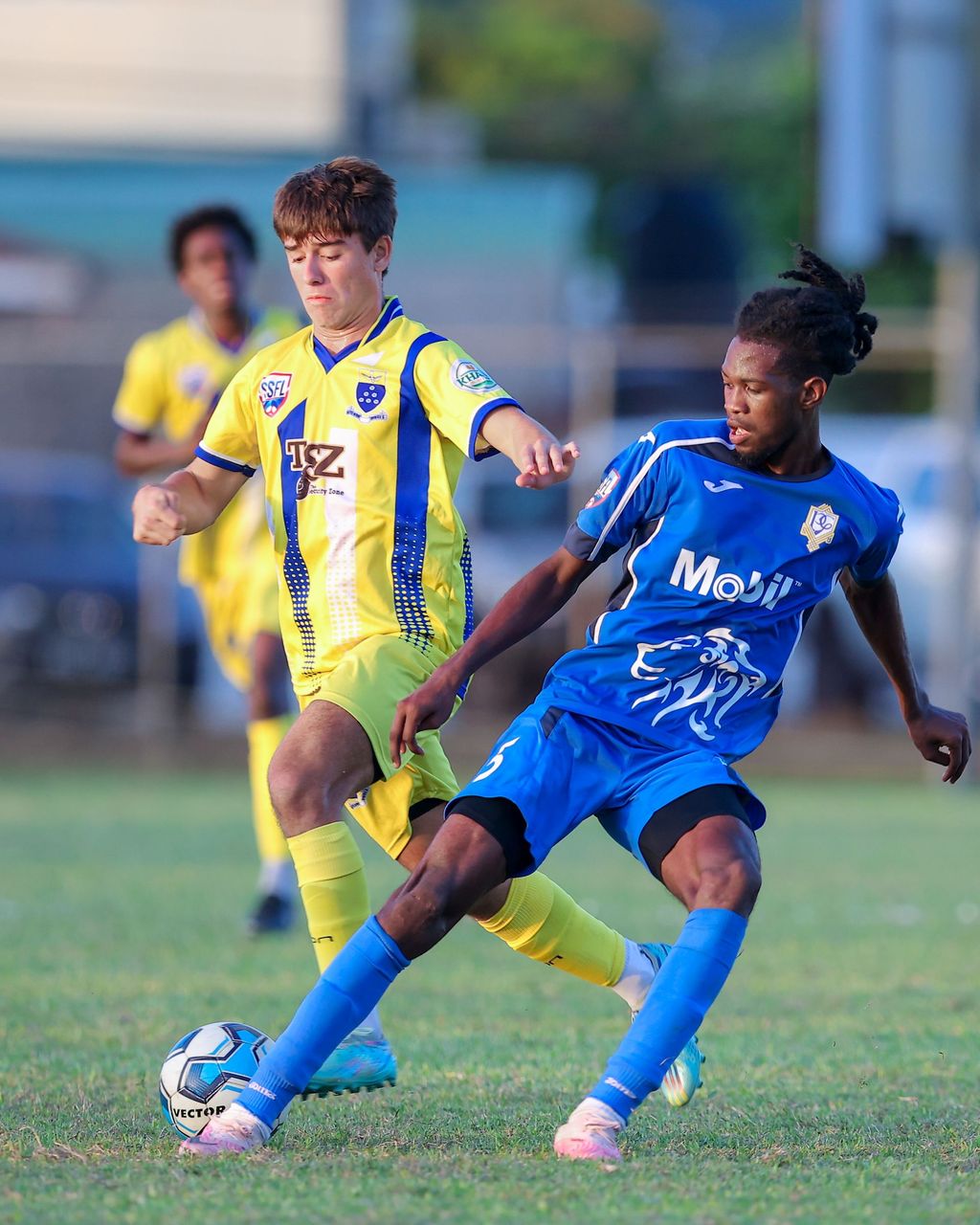 Presentation College San Fernando's defender Tyrel Pemberton, right, blocks Fatima College's Michael Chaves counter attack during the SSFL Premiership match at the Fatima College ground in Port-of-Spain, yesterday. Presentation college won 1-0. 