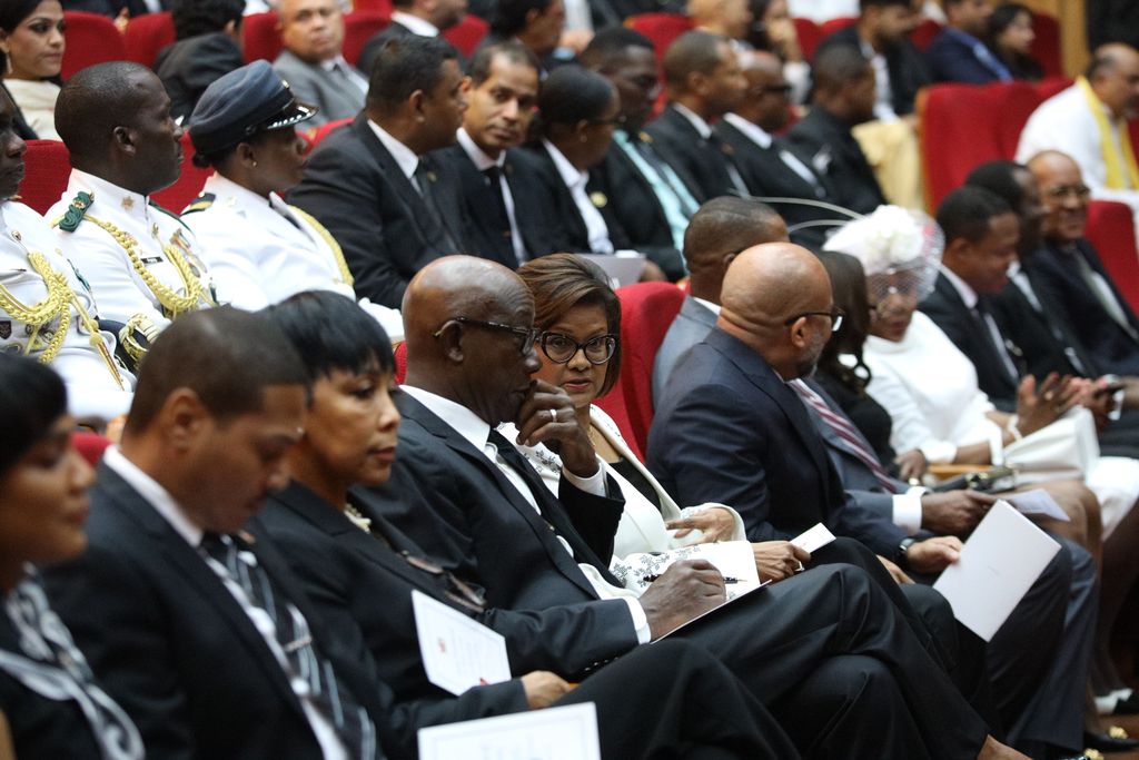 Prime Minister Dr Keith Rowley speaks with President Christine Kangaloo during the funeral of former prime minister Basdeo Panday at the Southern Academy for the Performing Arts in San Fernando yesterday. 