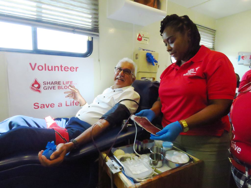 Nurse Sparking Jones draws blood from Minister of Health Terrence Deyalsingh during the Ministry of Health’s Blood Donation Drive at the Brian Lara Promenade, Port-of-Spain yesterday.