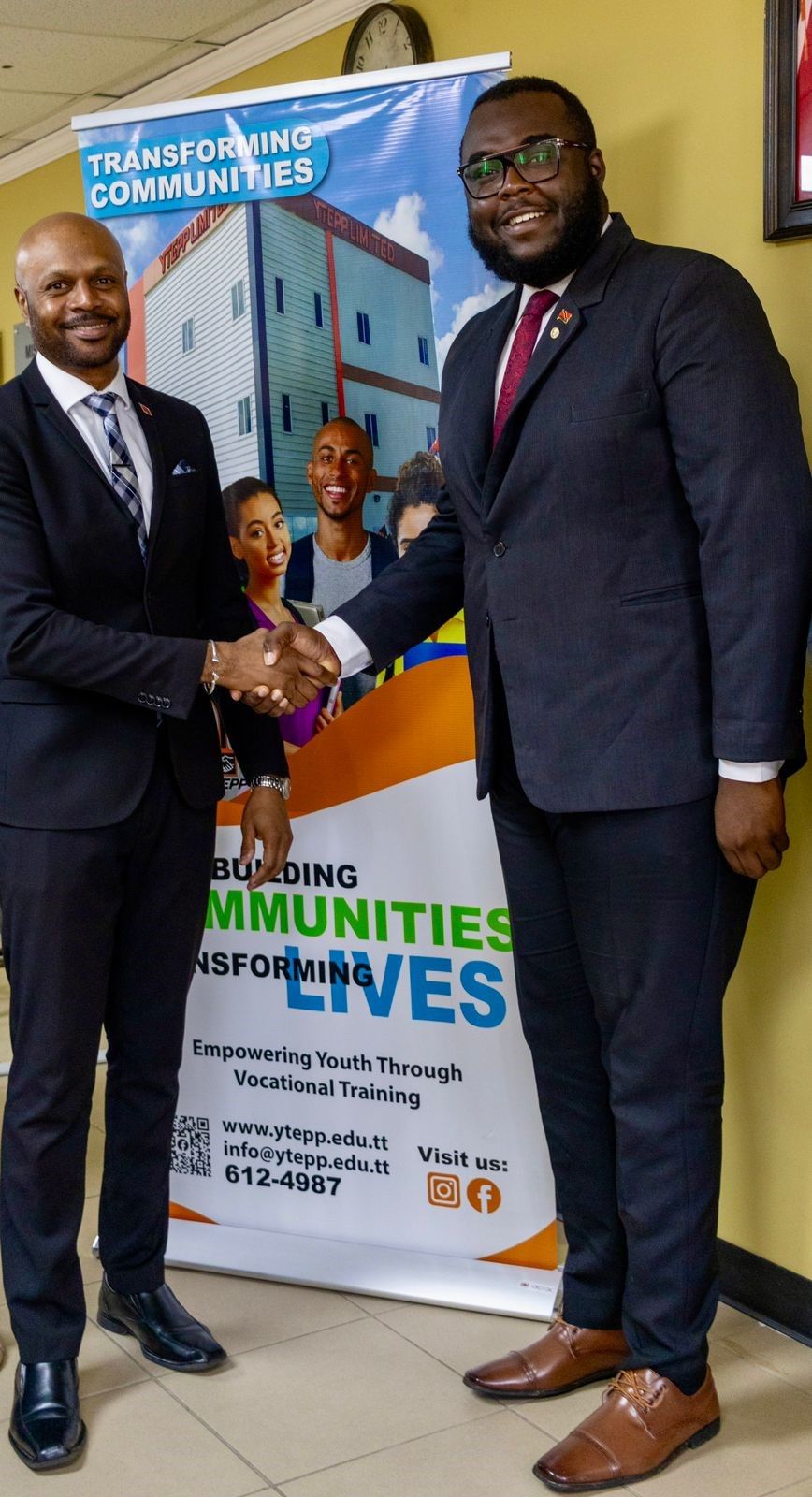 YTEPP’s director of EDSS Montgomery Guy, left, greets the president of TYC Shane John at YTEPP’s Chaguanas office on Monday.