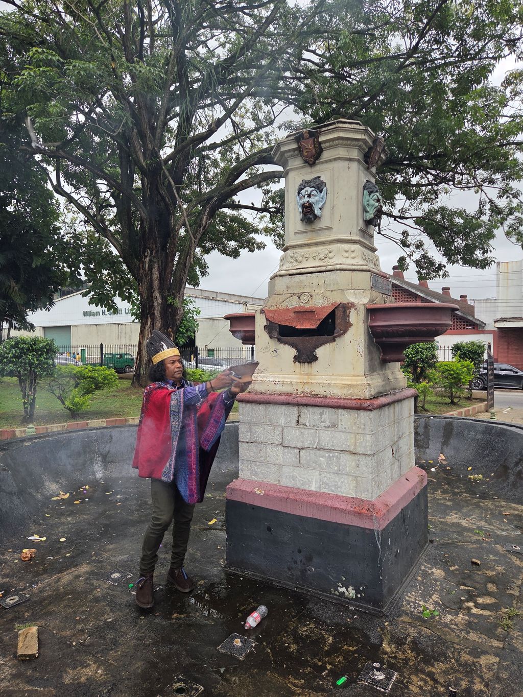 HE Kasekay Chief Camillus Sabala, of the First Peoples Sovereign Nation in T&T, performs a smoke ceremony at the site where the Columbus statue once stood in Port-of-Spain yesterday. The statue was removed on Wednesday night.