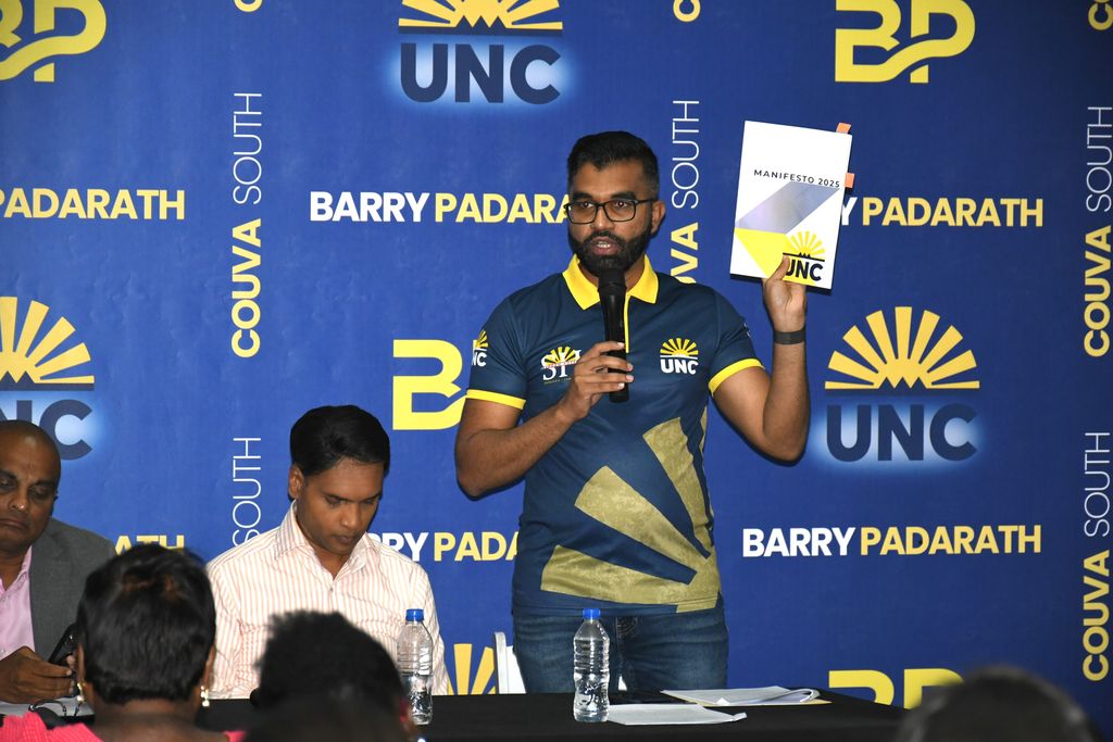 Minister of Legal Affairs Saddam Hosein speaks during the UNC’s consultation on the proposed legislation at the Caldrac Recreation Club, Dow Village, California, on Wednesday. At left is Public Utilities Minister Barry Padarath.