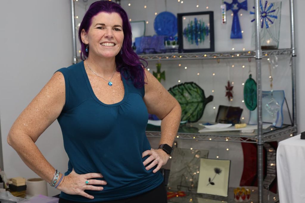 Kristy Johnson with some of her fused glass artworks.