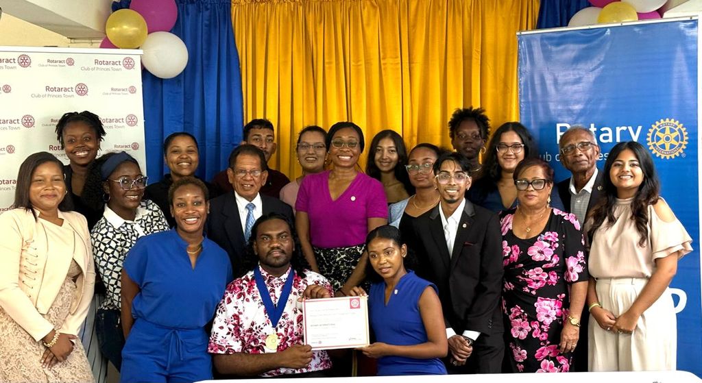Rotaract Club of Princes Town president Avinash Ramlochan, fourth from left, and president-elect Lara Lee, to his right, join members of the Rotary and Rotaract clubs of Princes Town.