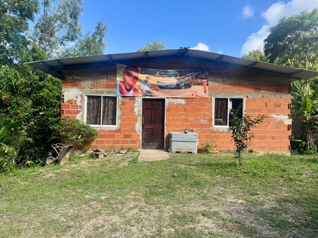 A banner of Chad Joseph hangs outside the home of his mother, Lenore Joseph, in Matelot, last week.