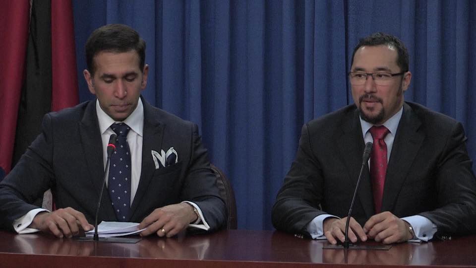 Minister in the Office of the Attorney General and Minister in the Office of the Prime Minister, Stuart Young, right, answers a question from members of the media during the post-Cabinet press briefing yesterday. At left, is Attorney General Faris Al-Rawi.